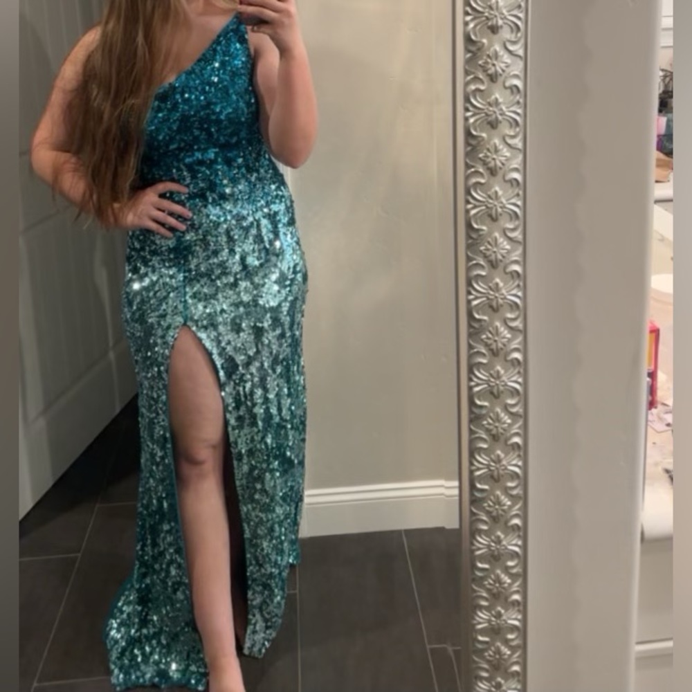 Teal/silver ombré prom dress.  Beautiful silloutte is super flattering.